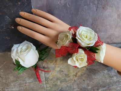 White spray rose wrist corsage with matching boutonniere