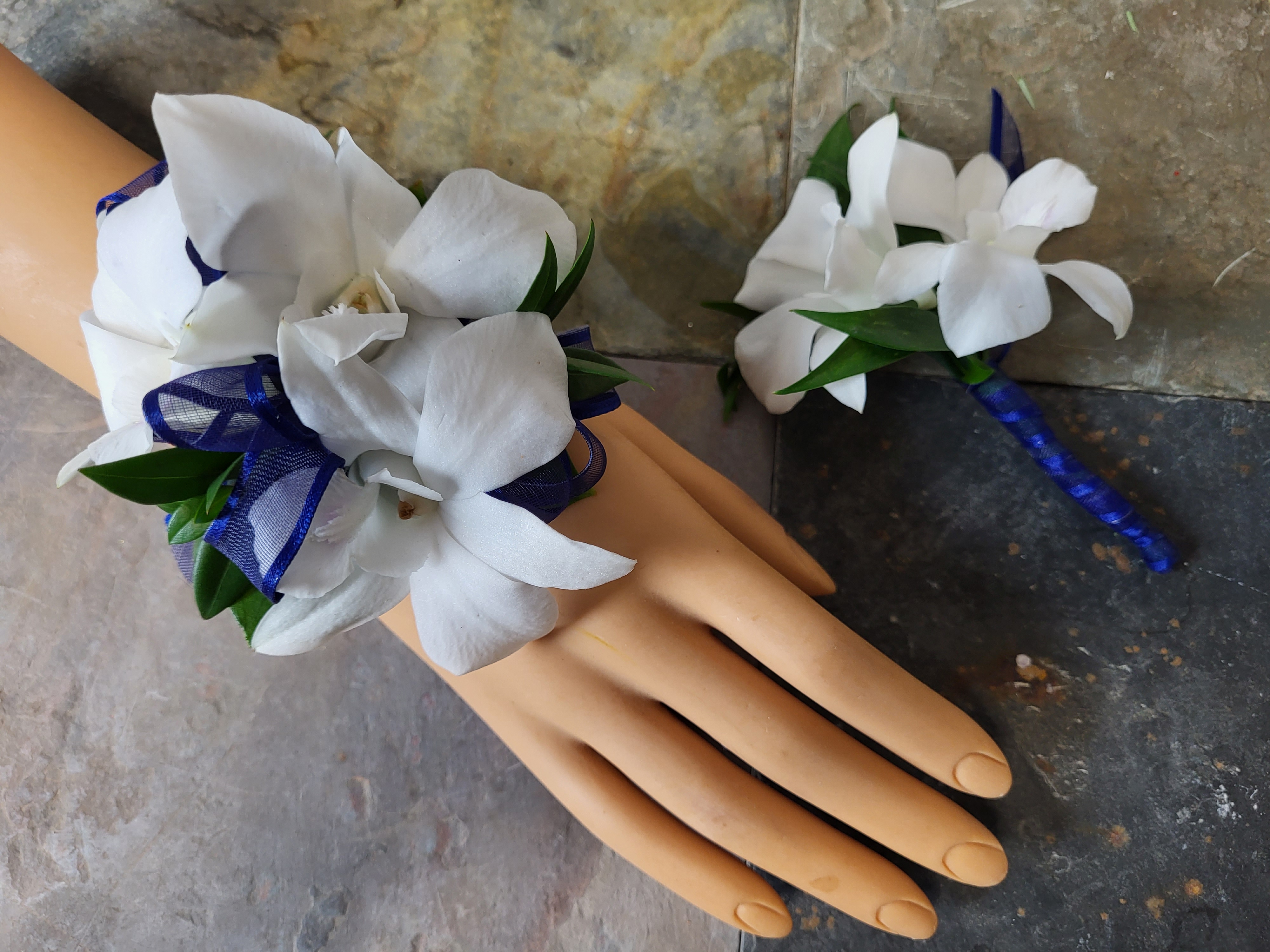 Dendrobium orchid wrist corsage and matching boutonniere